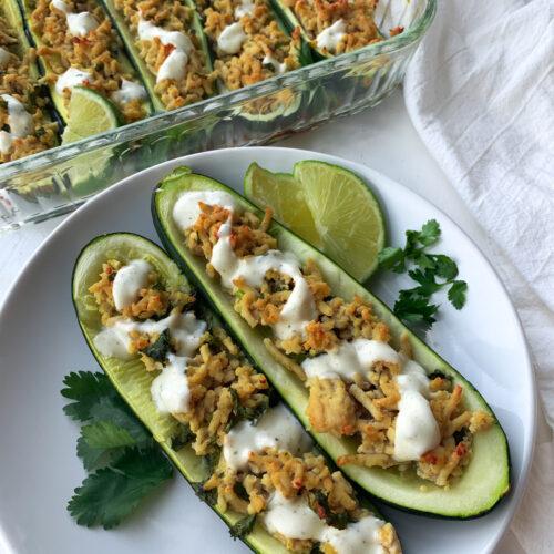 close-up shot of cilantro lime chicken being stuffed into zucchini halves