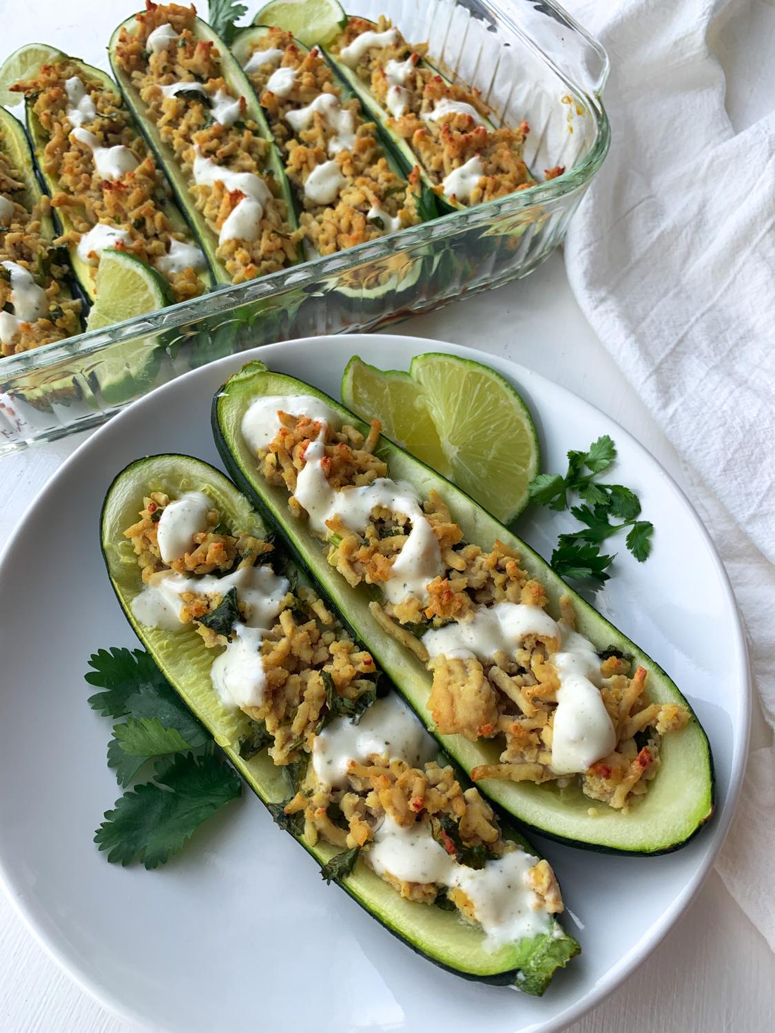 cilantro lime chicken stuffed zucchini on a plate