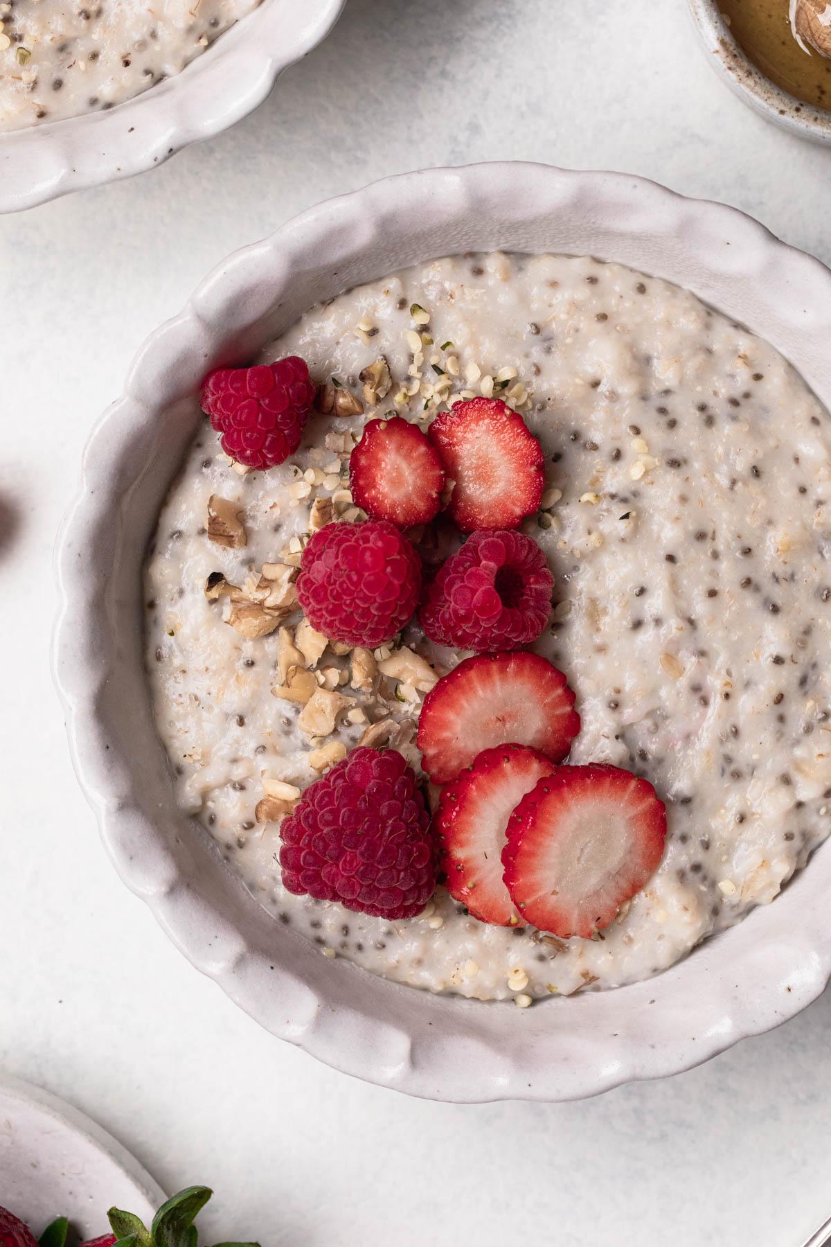 close up shot of finished strawberry hemp seed oatmeal with spoon