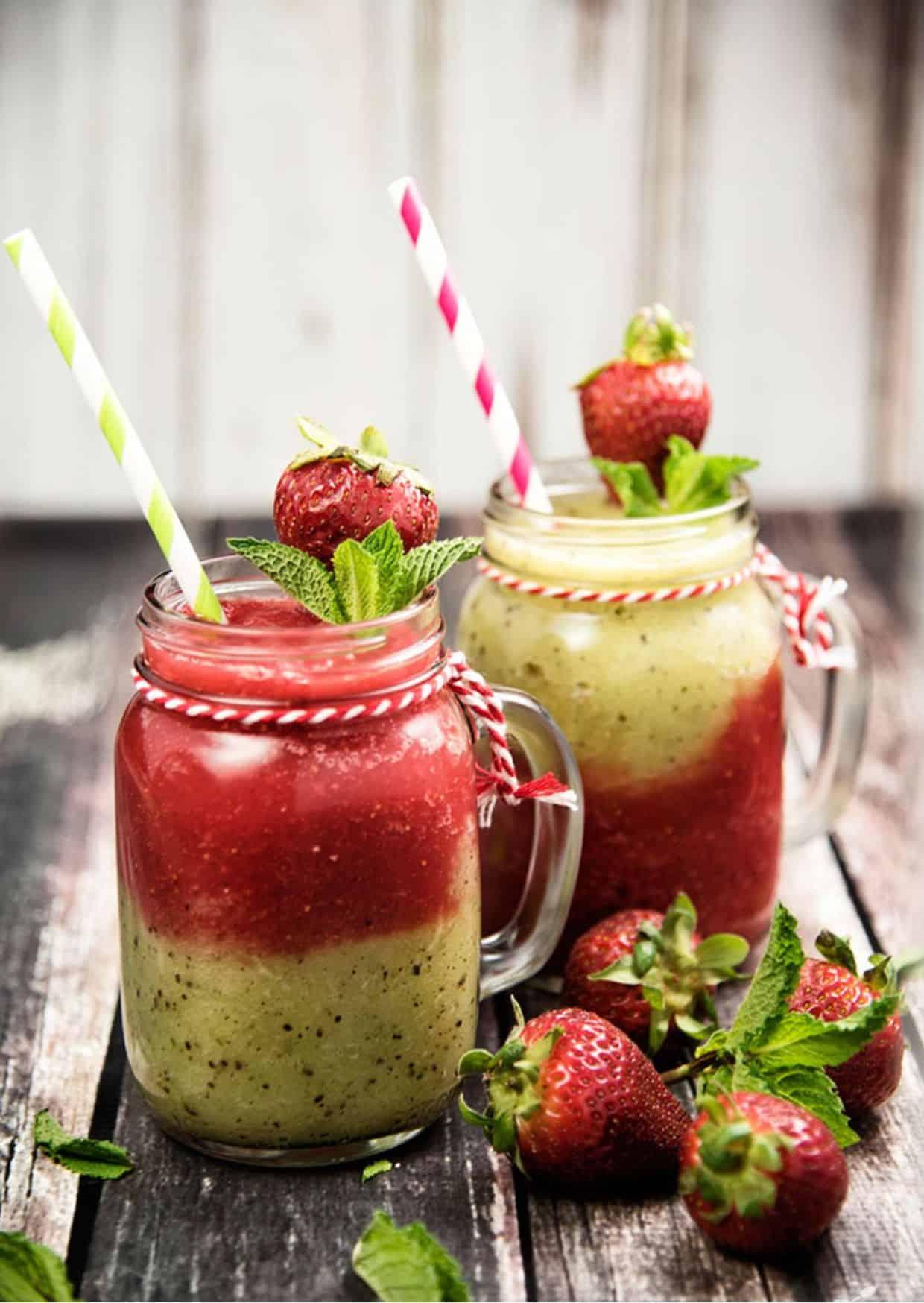 A person enjoying a Kiwi Mint Strawberry Refresher Pop outdoors