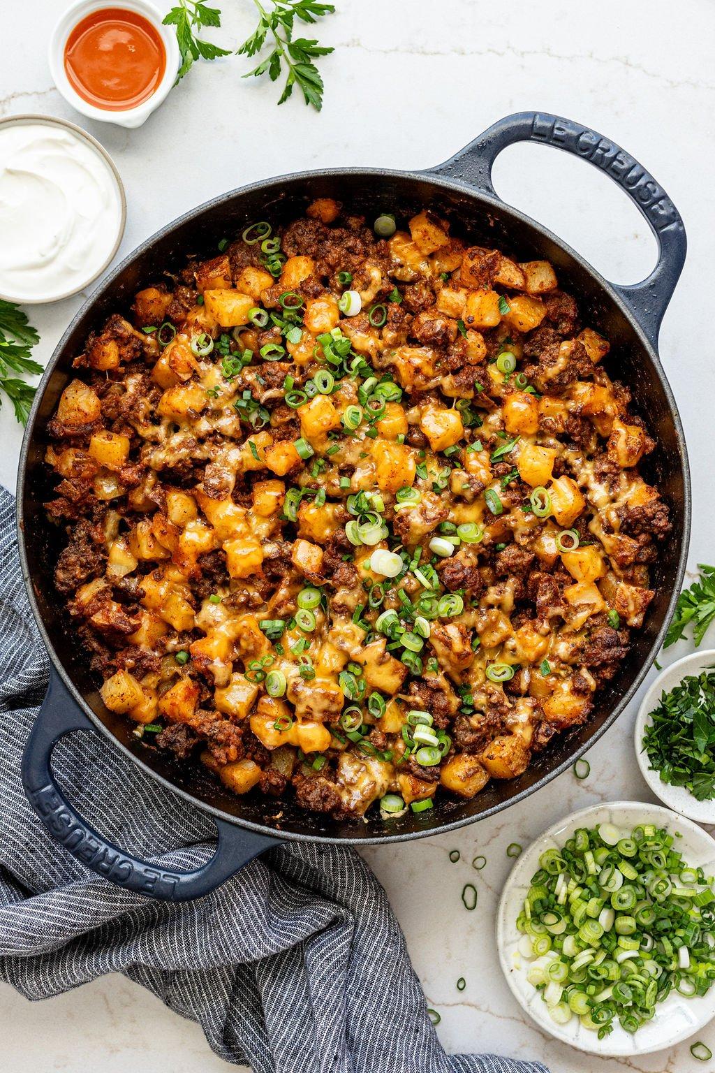 ground beef being cooked in a pan with chili spices and blood orange zest