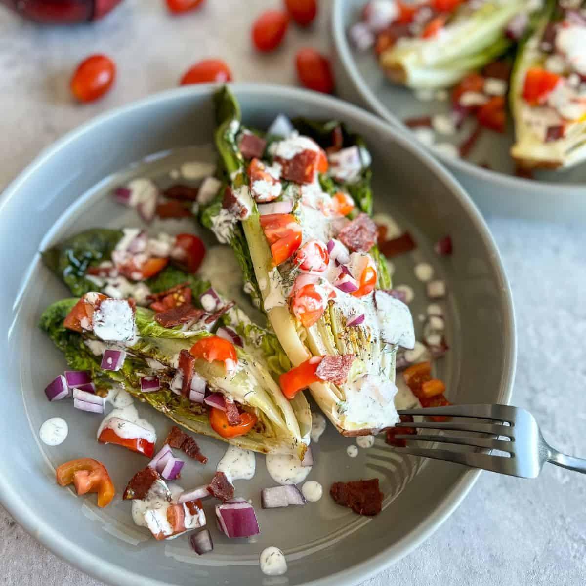 grilled wedge salad with ranch dressing and sliced tomatoes