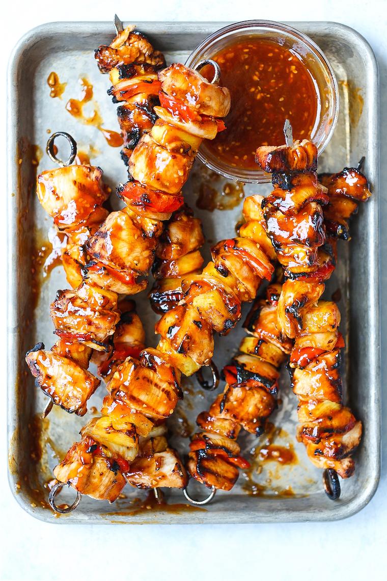 grilled chicken and pineapple skewers on a barbecue