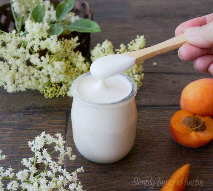 close up elderflower lemon yogurt parfait with spoon