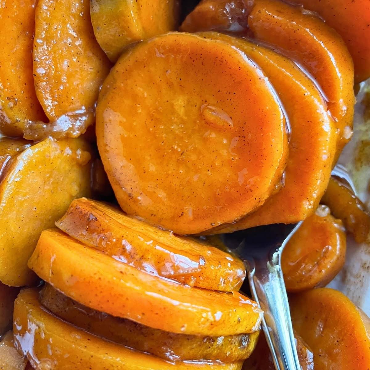 close-up of slow-cooked sweet potato cubes, slightly caramelized and glistening