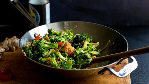 close up view of broccoli bonanza stir fry in a wok