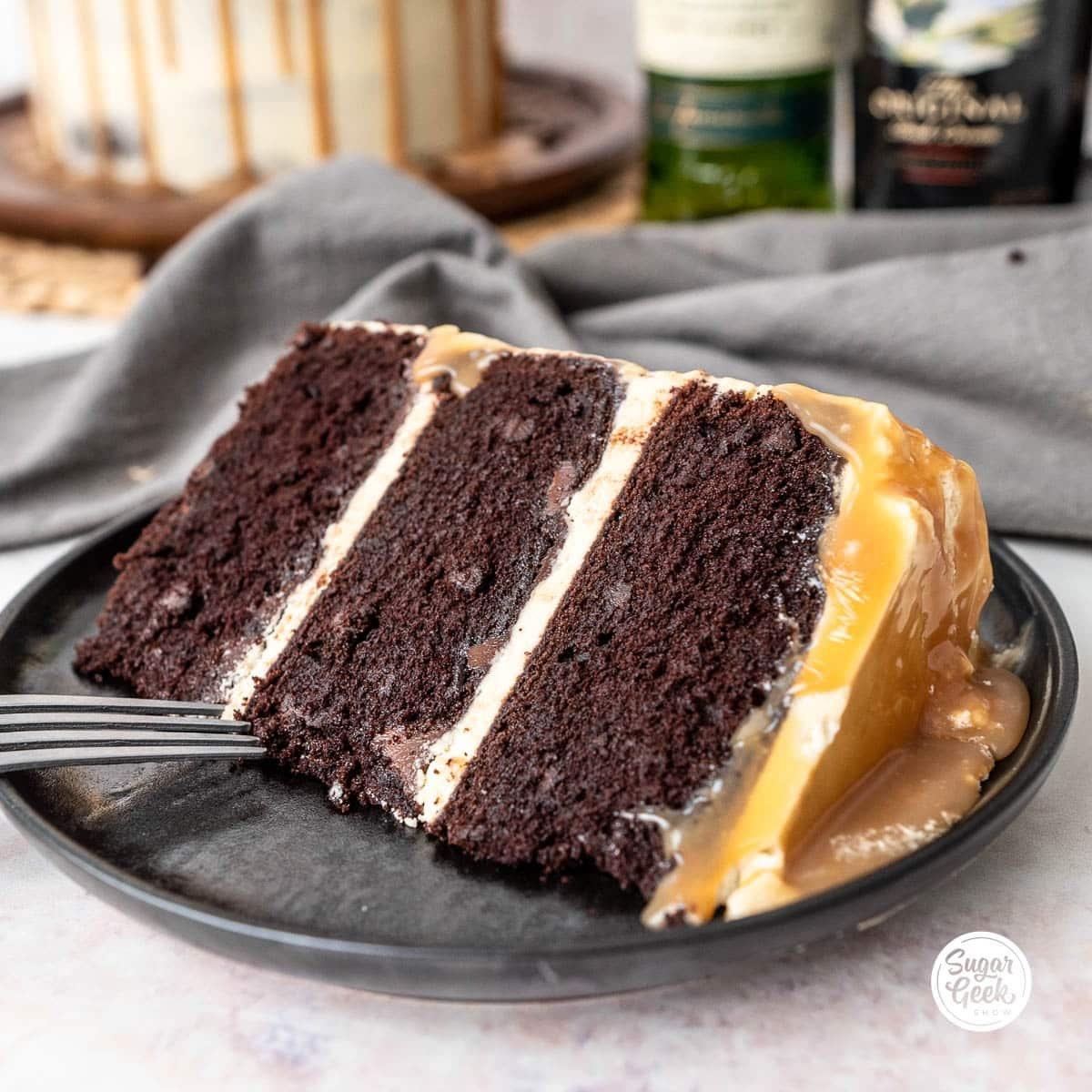 slice of chocolate cake with irish cream frosting and coffee beans