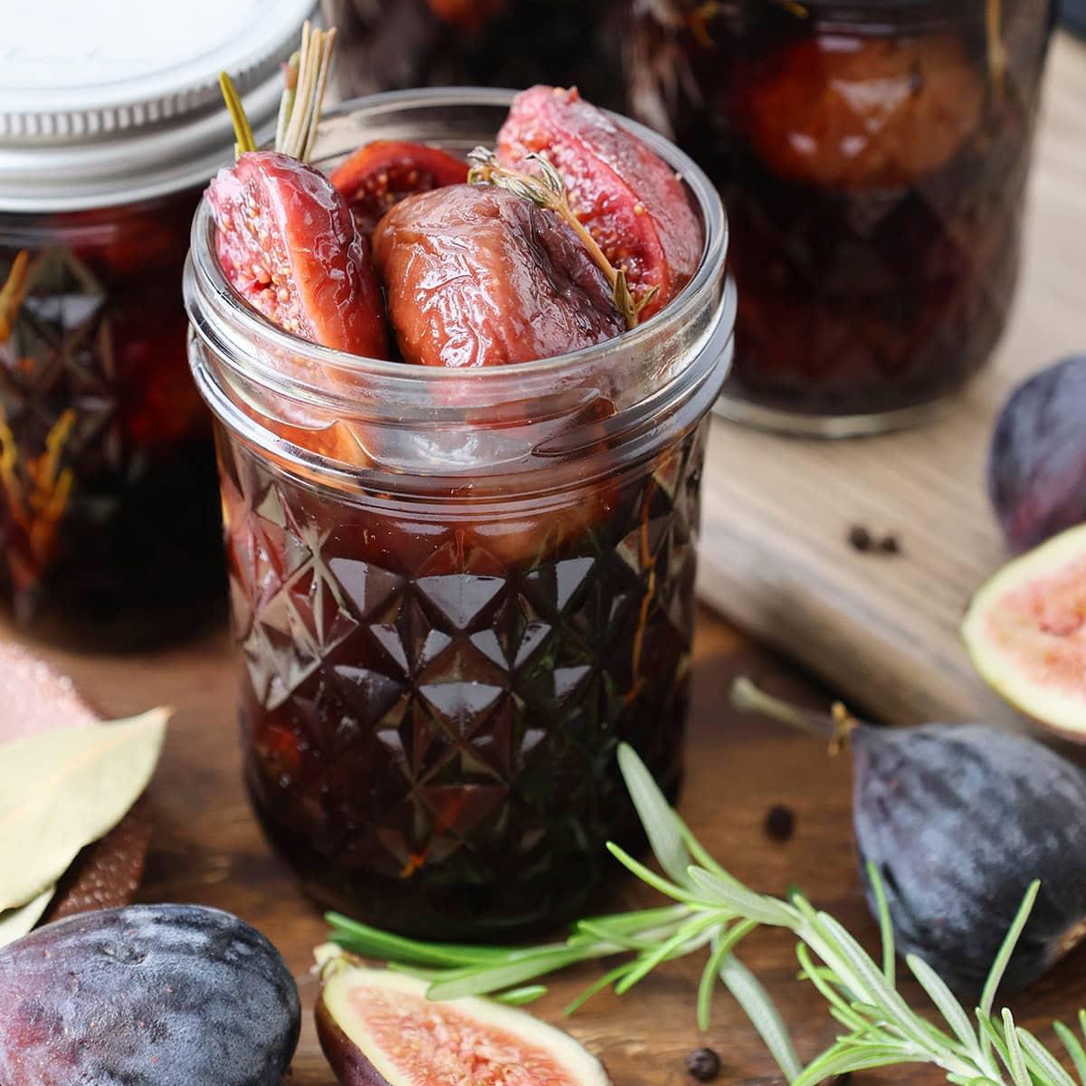 jar of homemade balsamic fig jam with fresh figs