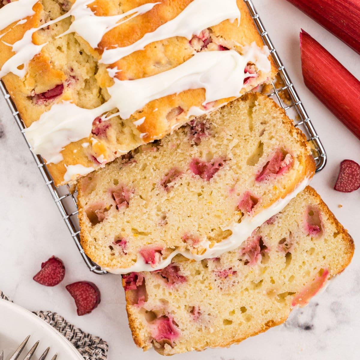 Close-up of a slice of rhubarb-date bread showing the texture and inclusions