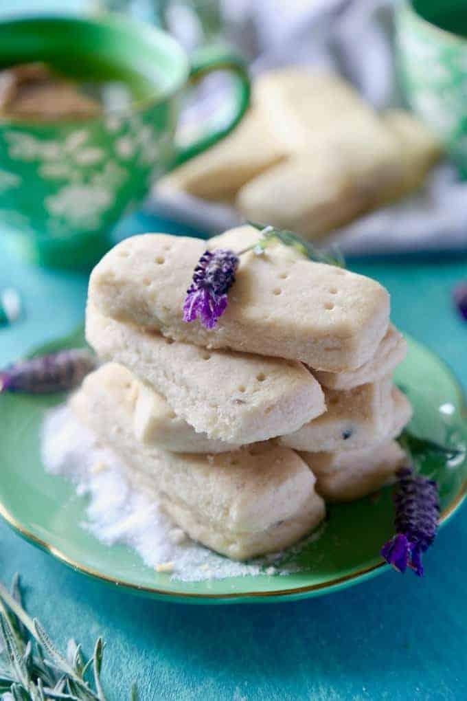 close up of rhubarb lavender cookies on a plate with lavender sprigs