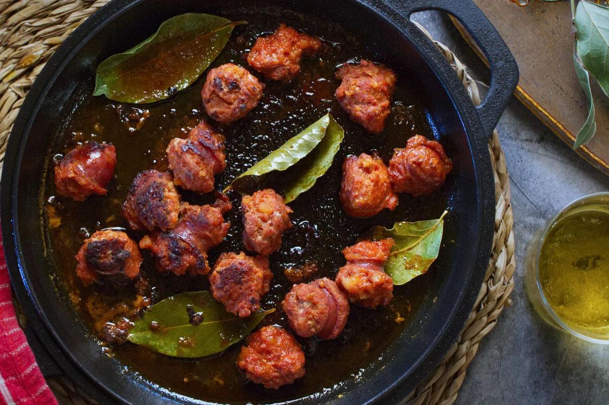 Close-up of chorizo being sautéed in a pan