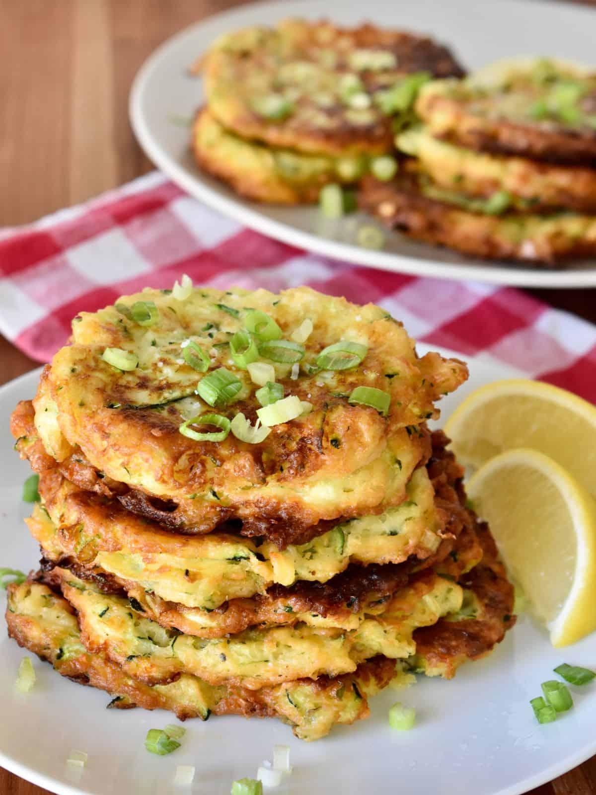 zucchini ricotta fritters served on a plate