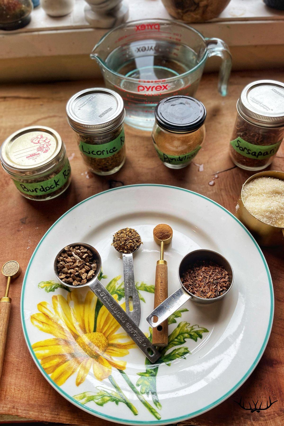 ingredients for homemade root beer on a wooden countertop