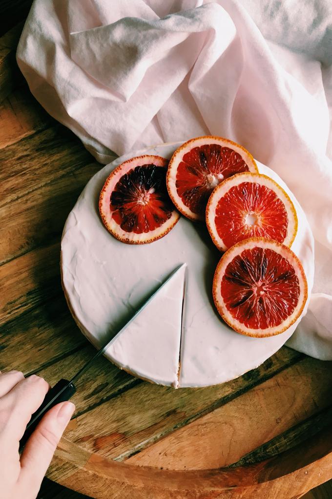 close-up of blood orange segments on top of a cheesecake