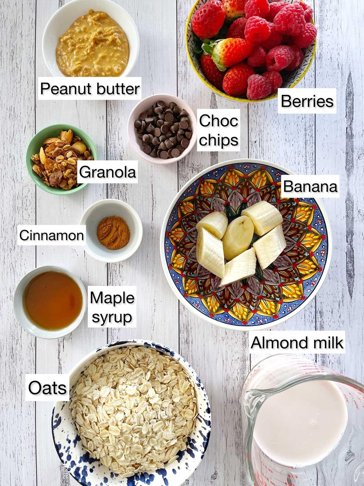 Close-up of the ingredients for sleep well overnight oats laid out on a wooden surface.