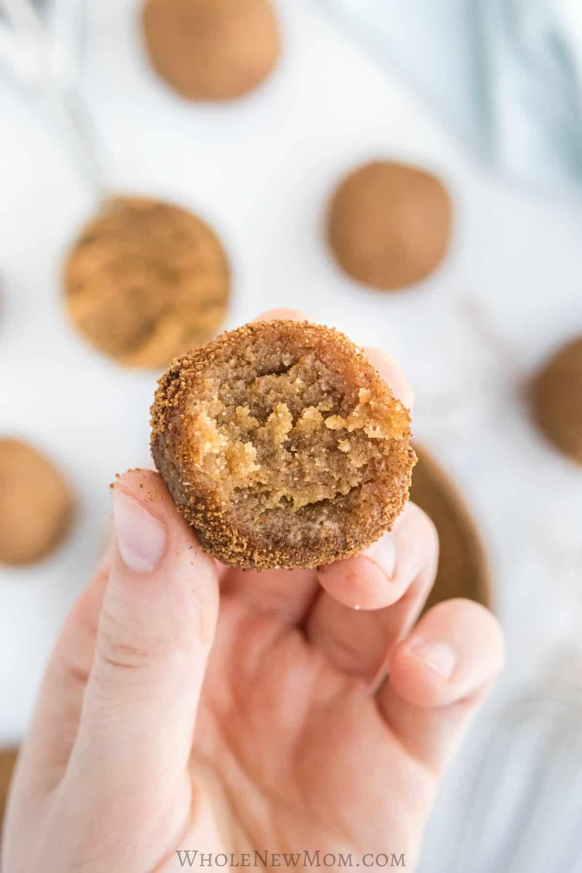hands rolling gluten-free snickerdoodle dough into balls