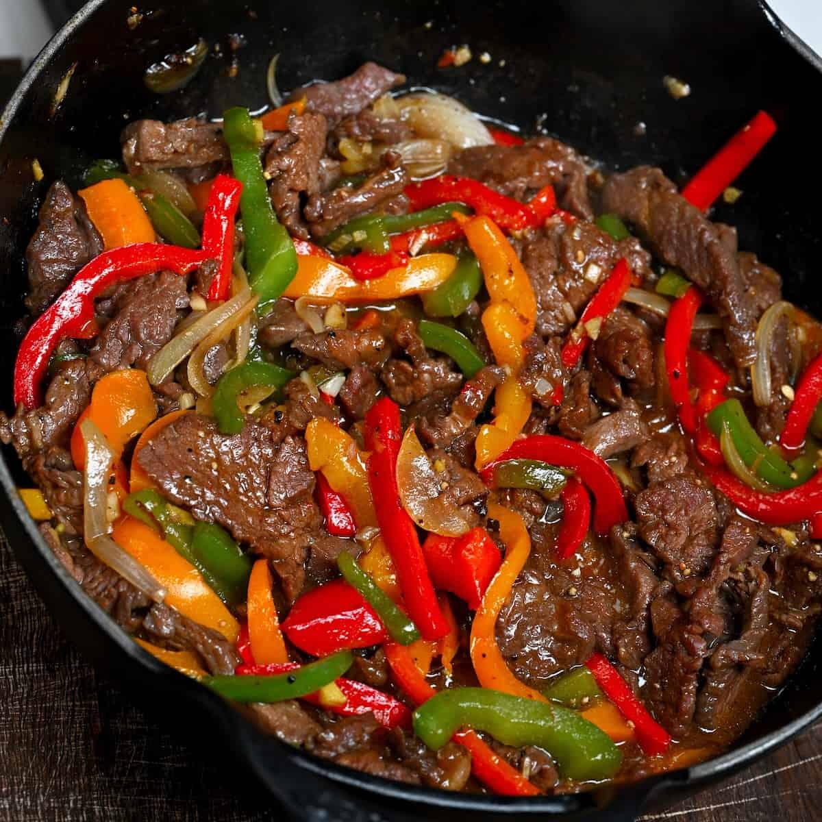 ingredients for beef and bell pepper stir-fry on a kitchen counter