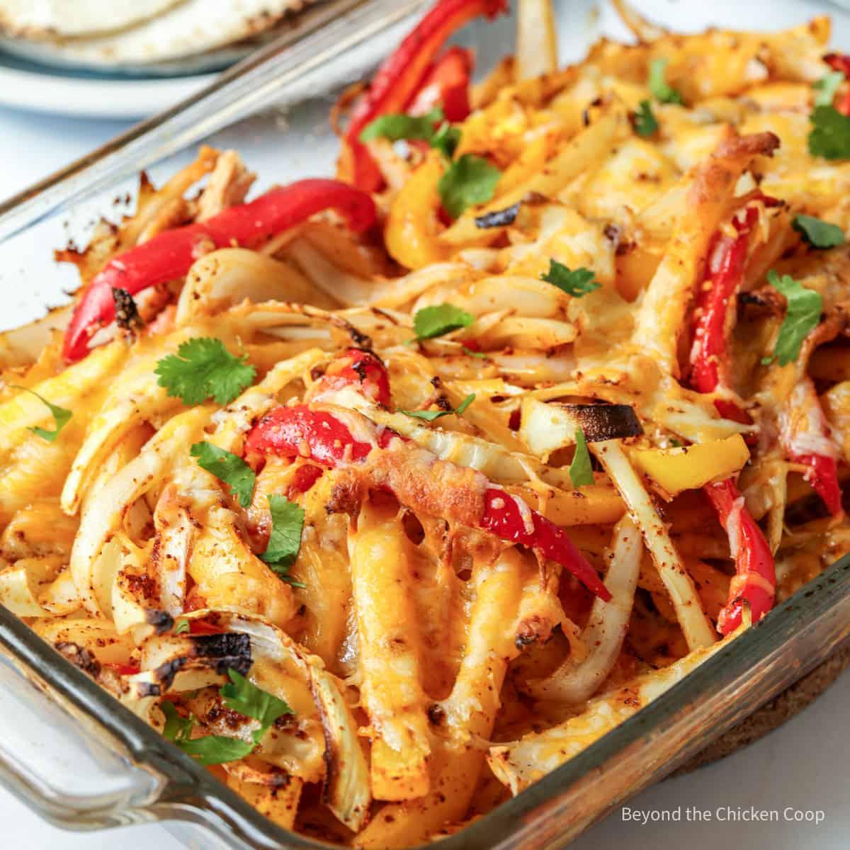 chicken fajita casserole being taken out of the oven