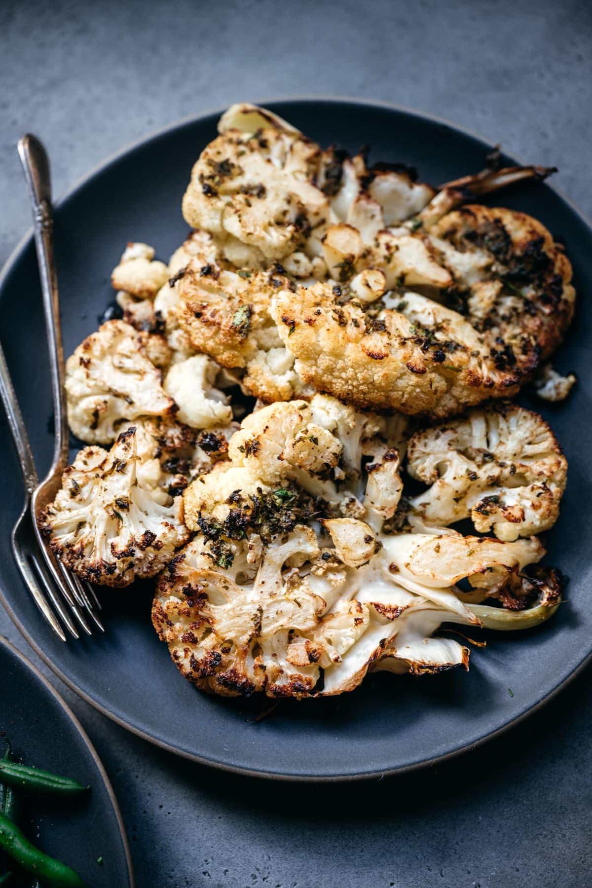 close up of cauliflower steak on plate
