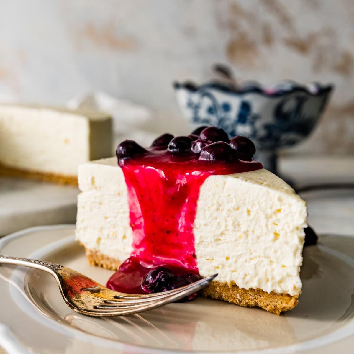 Overhead shot of ingredients for Italian Mascarpone Cheesecake arranged on a marble countertop