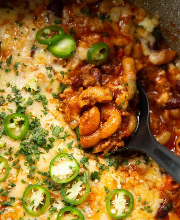 close up shot of vegetarian chili mac and cheese with melted cheese on top