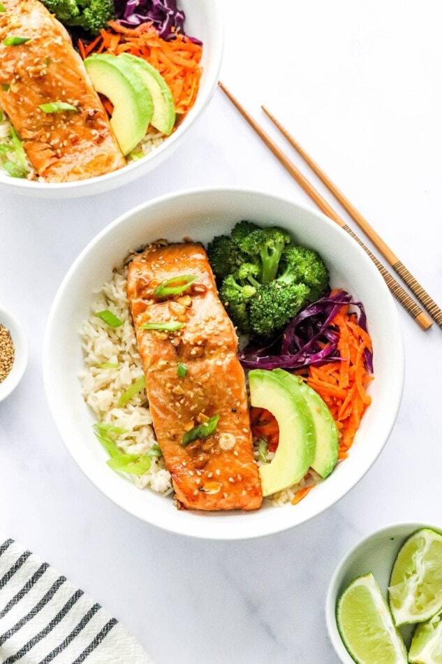 overhead shot of a complete teriyaki glazed salmon bowl with chopsticks