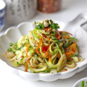 close-up shot of zoodles being stir-fried with vegetables