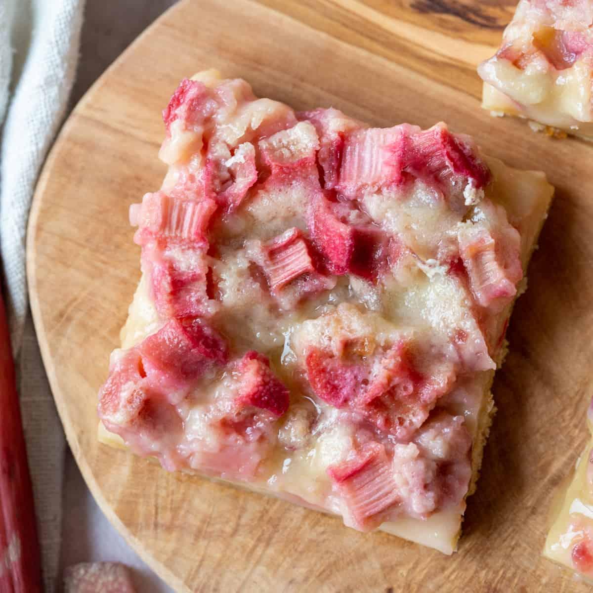 rustic rhubarb custard slab bars on a wooden board