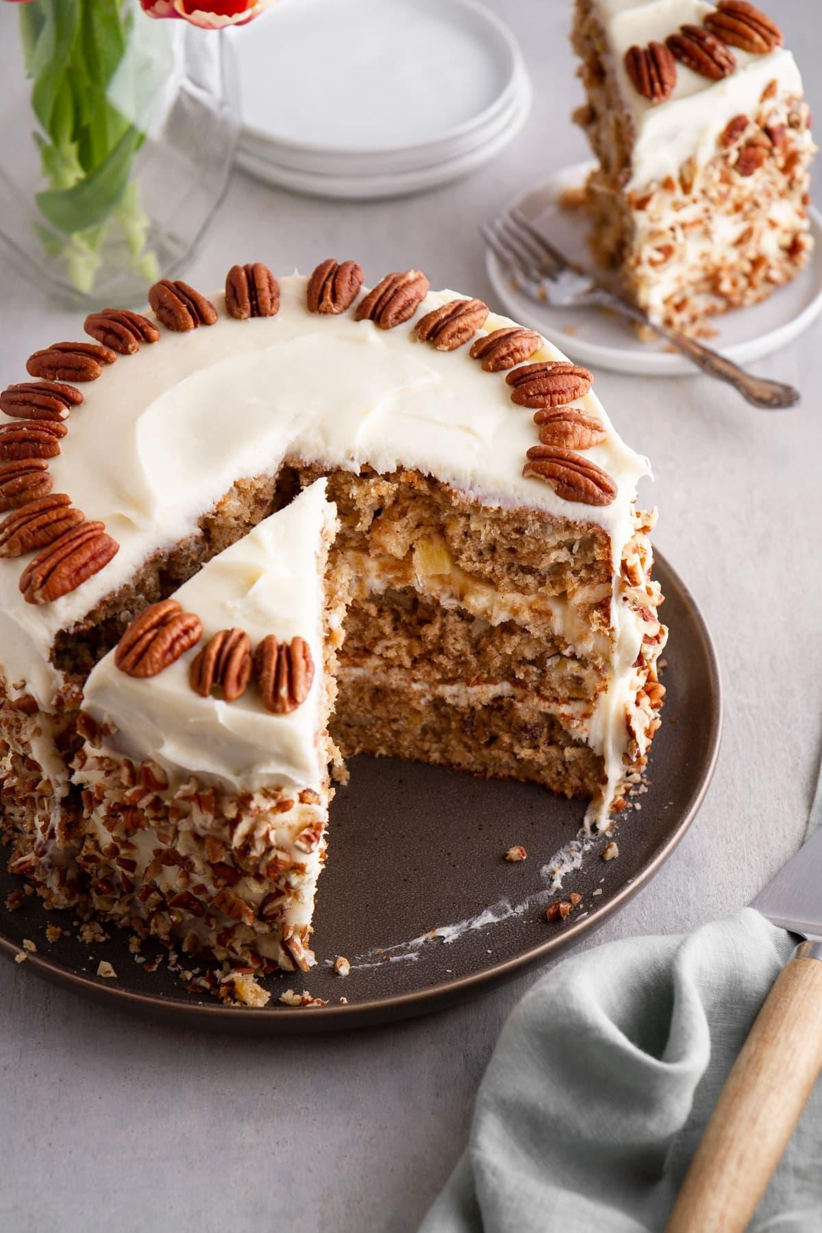 Slices of Apple Spice Hummingbird Cake stacked, showcasing the layers and moist texture