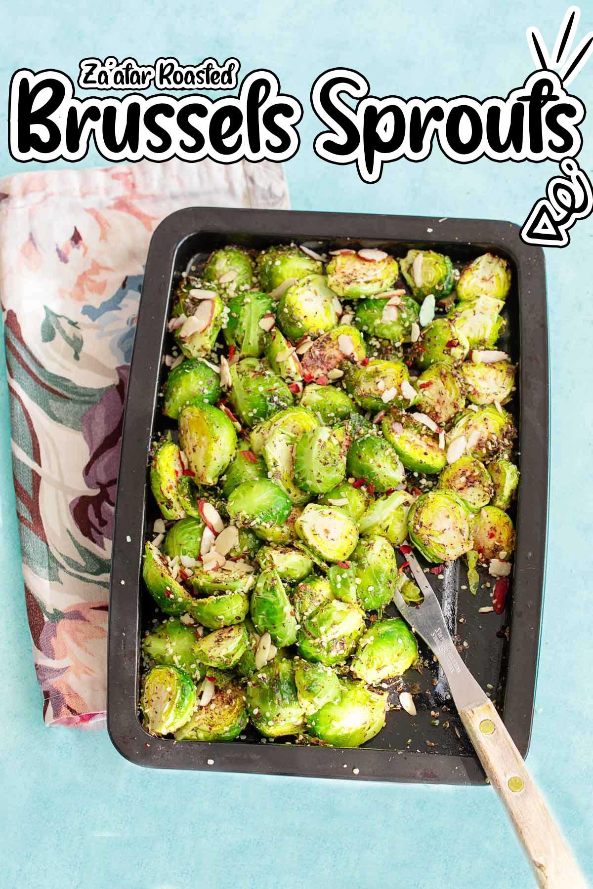 raw brussels sprouts tossed with olive oil and za'atar on a baking sheet