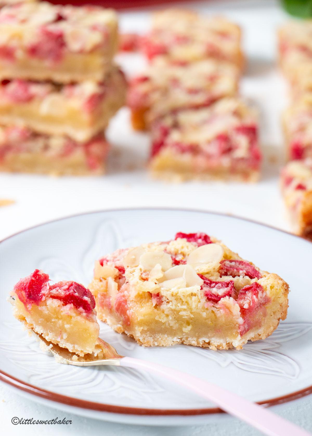 sweet and spicy rhubarb custard bars arranged on a serving platter