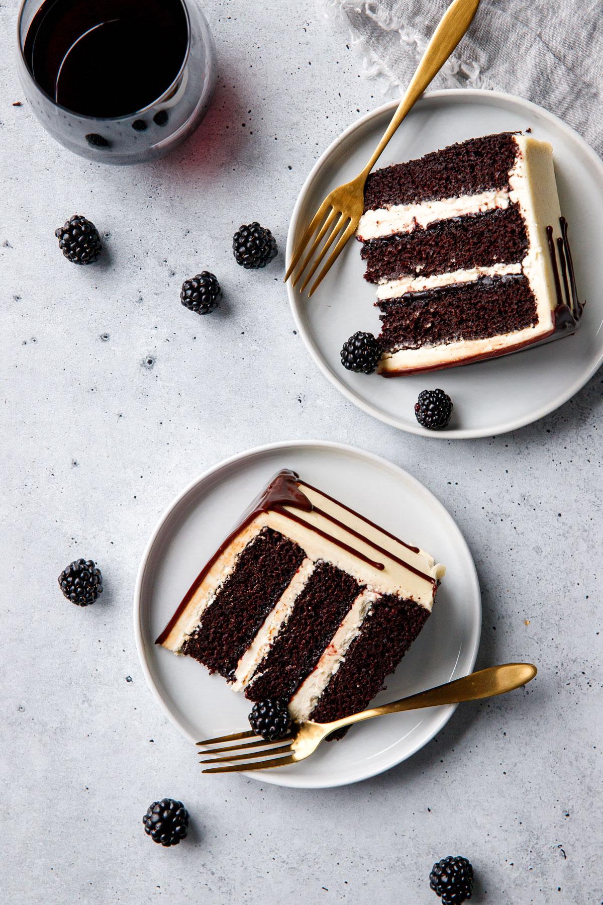 overhead shot of a red wine chocolate velvet cake being frosted