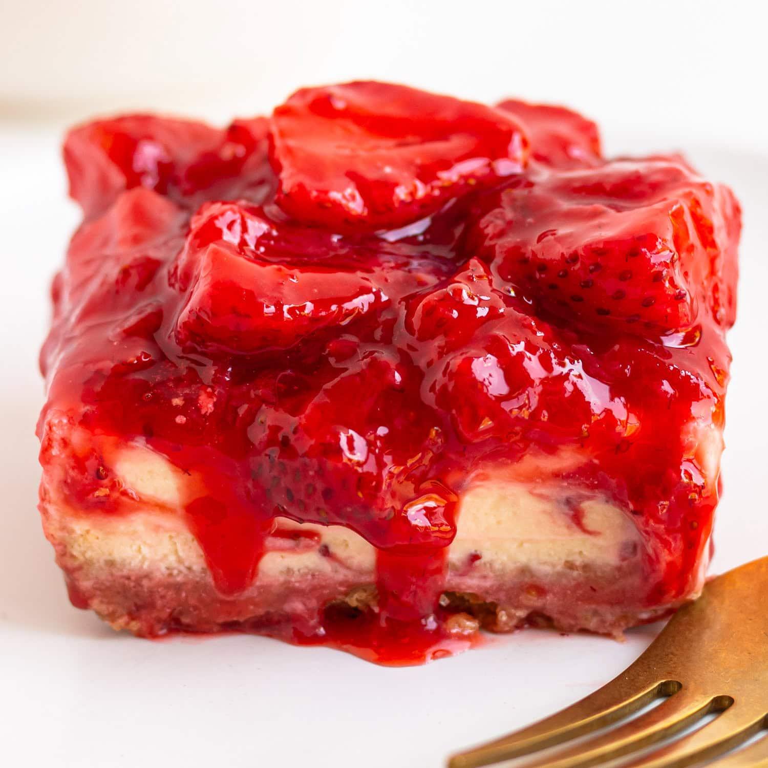 Close-up shot of a Maple Pecan Strawberry Cheesecake Bar slice