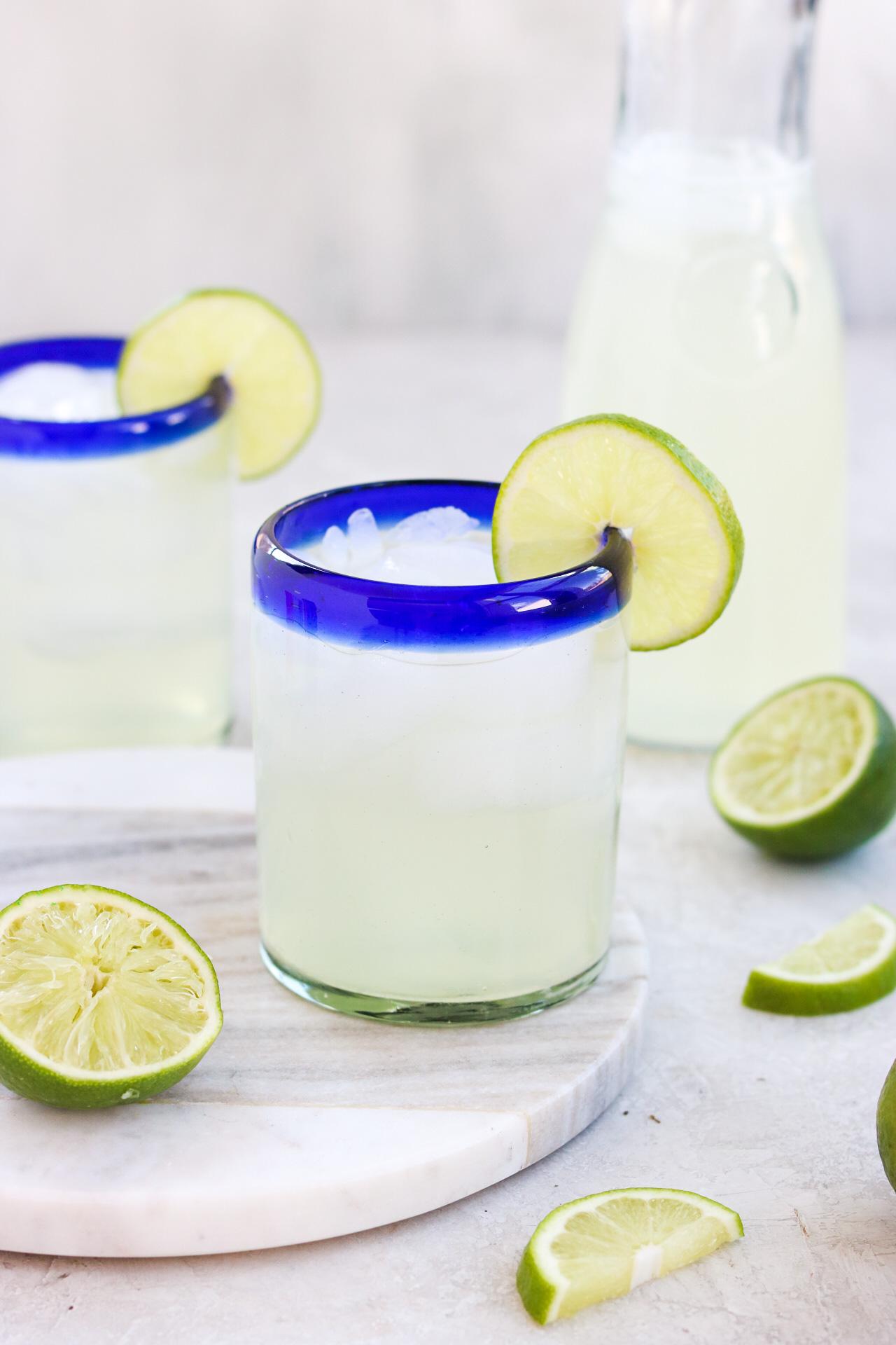 close up shot of limeade being poured into a glass