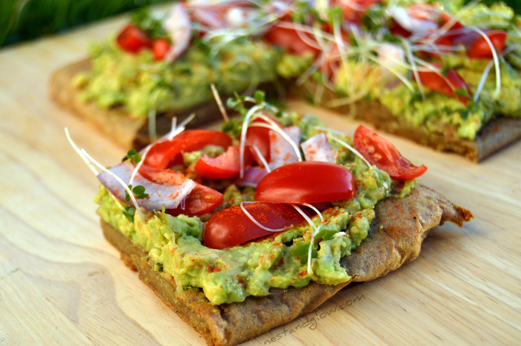 Chicken Quinoa and Avocado Toast on a wooden cutting board