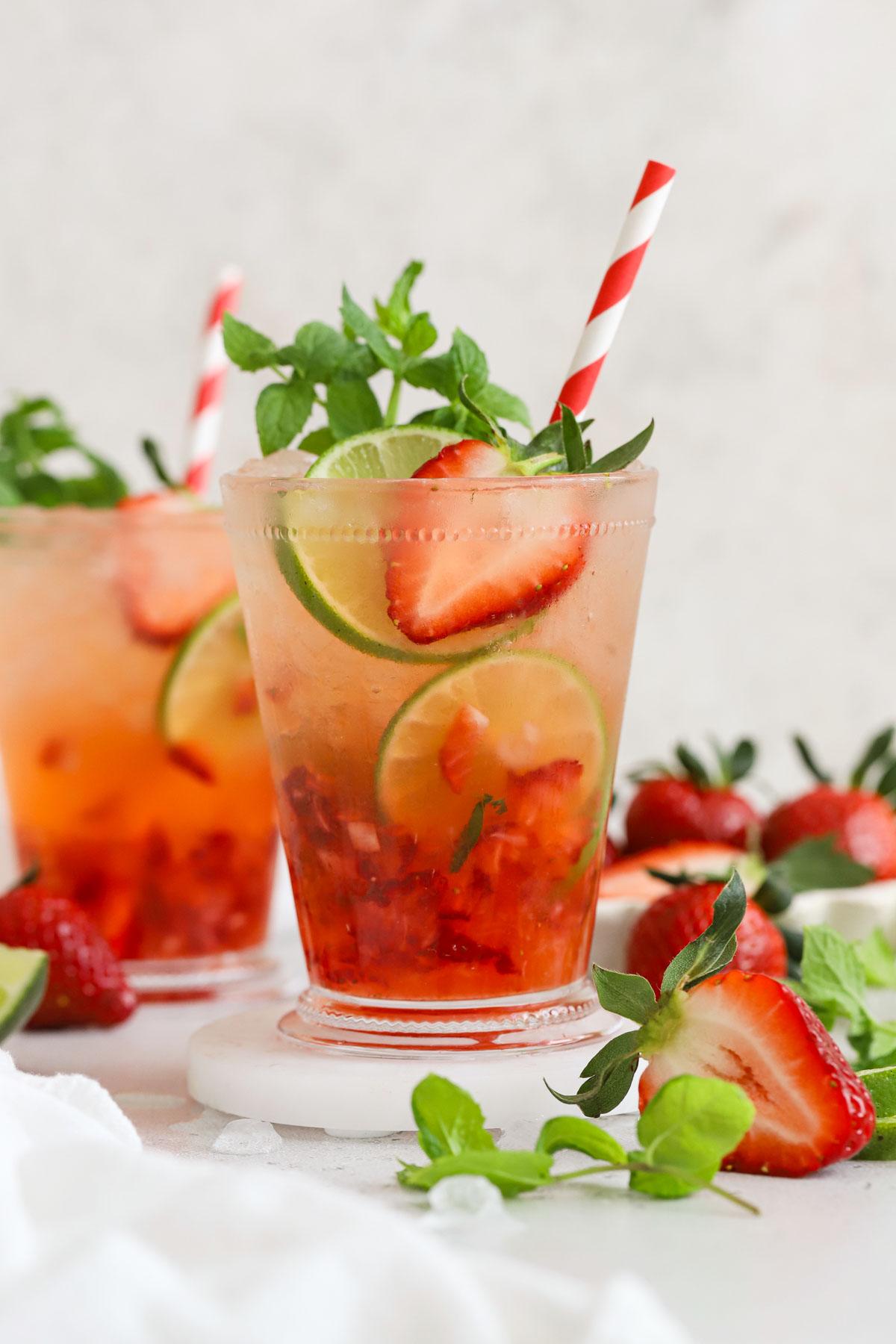 person holding a strawberry mint oatmeal julep and smiling