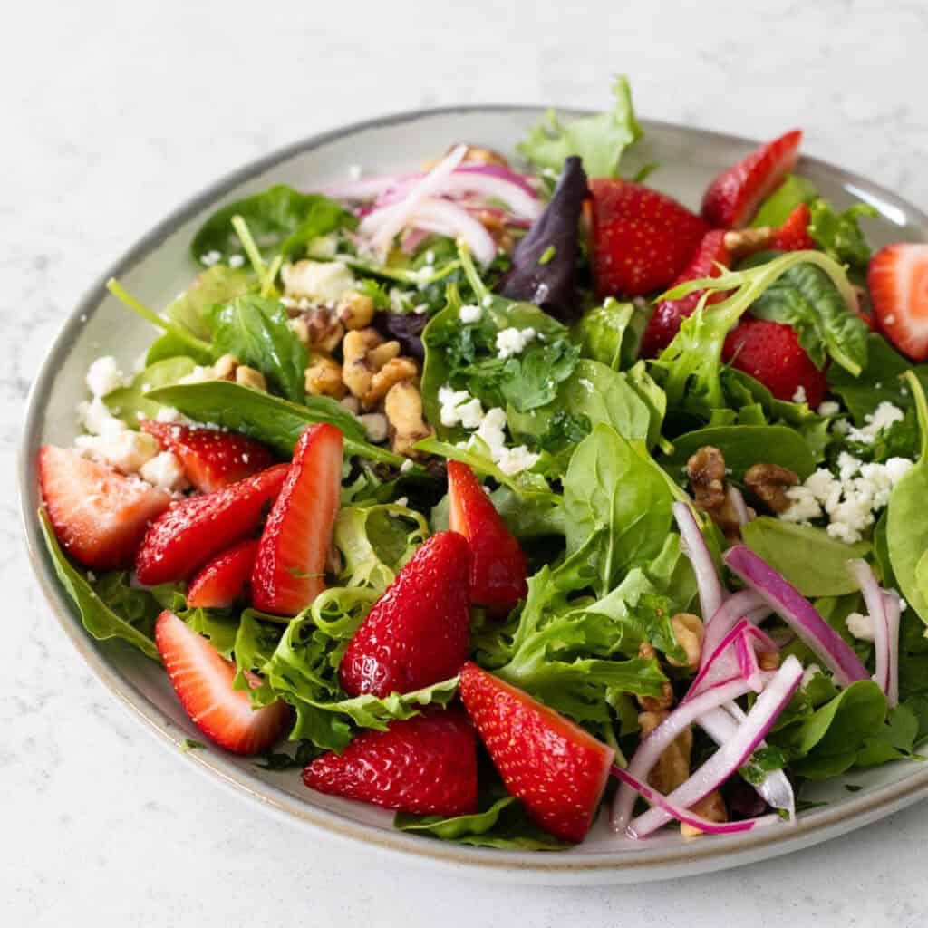 strawberry feta fontina salad in a bowl, ready to serve