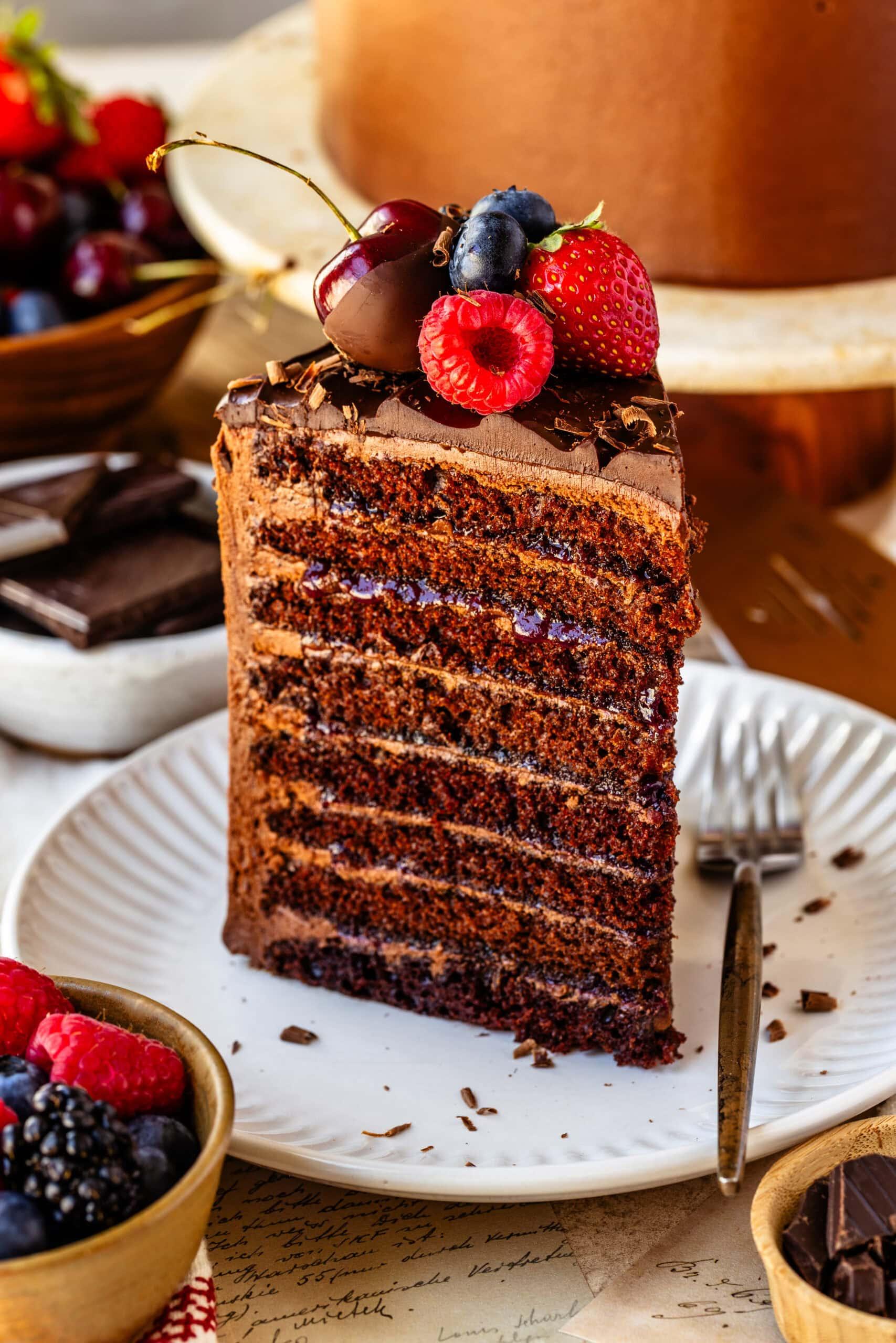 Close-up shot of a slice of Smoked Paprika Chocolate Ember Layer Cake, showing the layers.