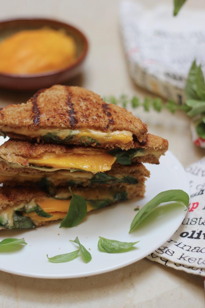 ingredients for mango salsa grilled cheese sandwich laid out on a wooden surface