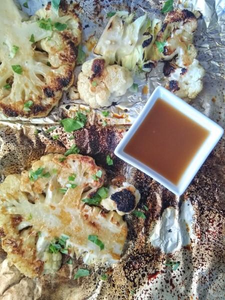 cauliflower steak drizzled with sesame ginger dressing