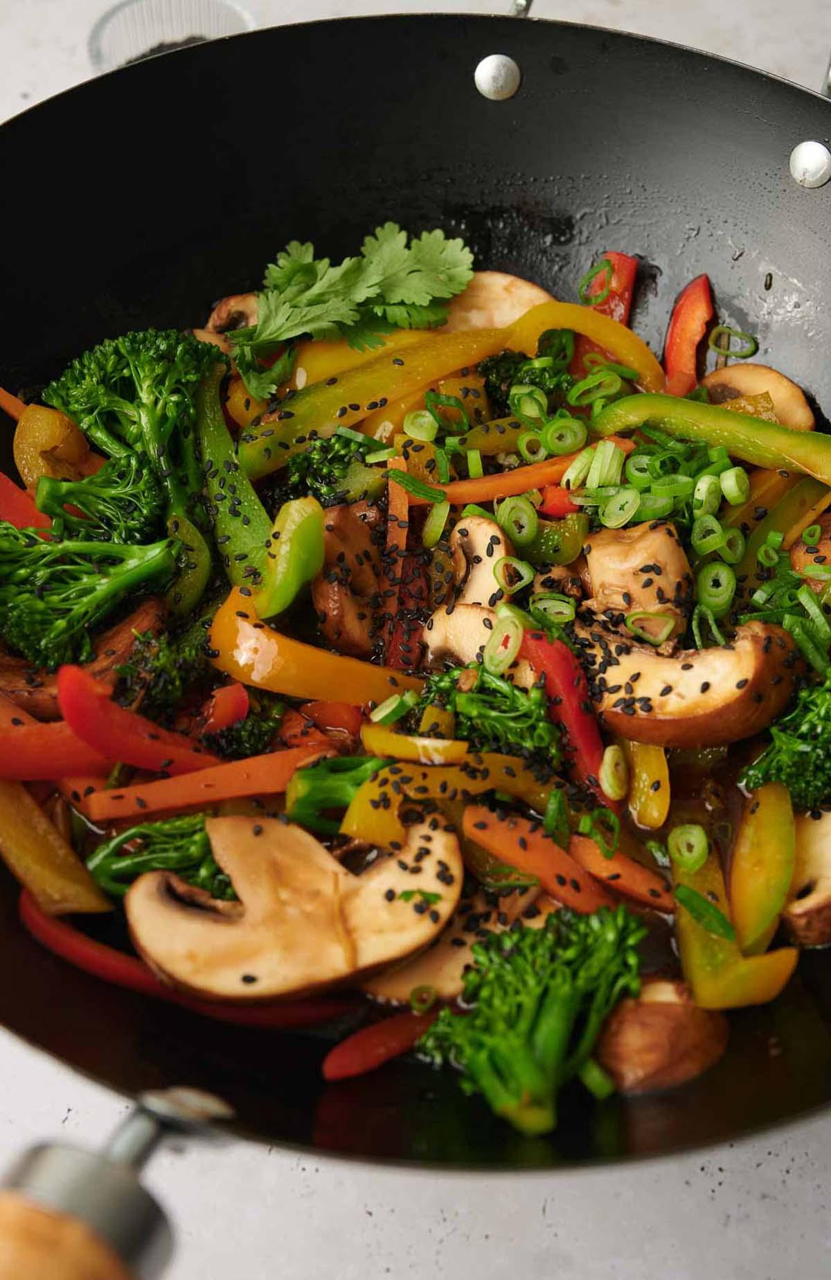 Vegetable stir-fry with coriander in a wok