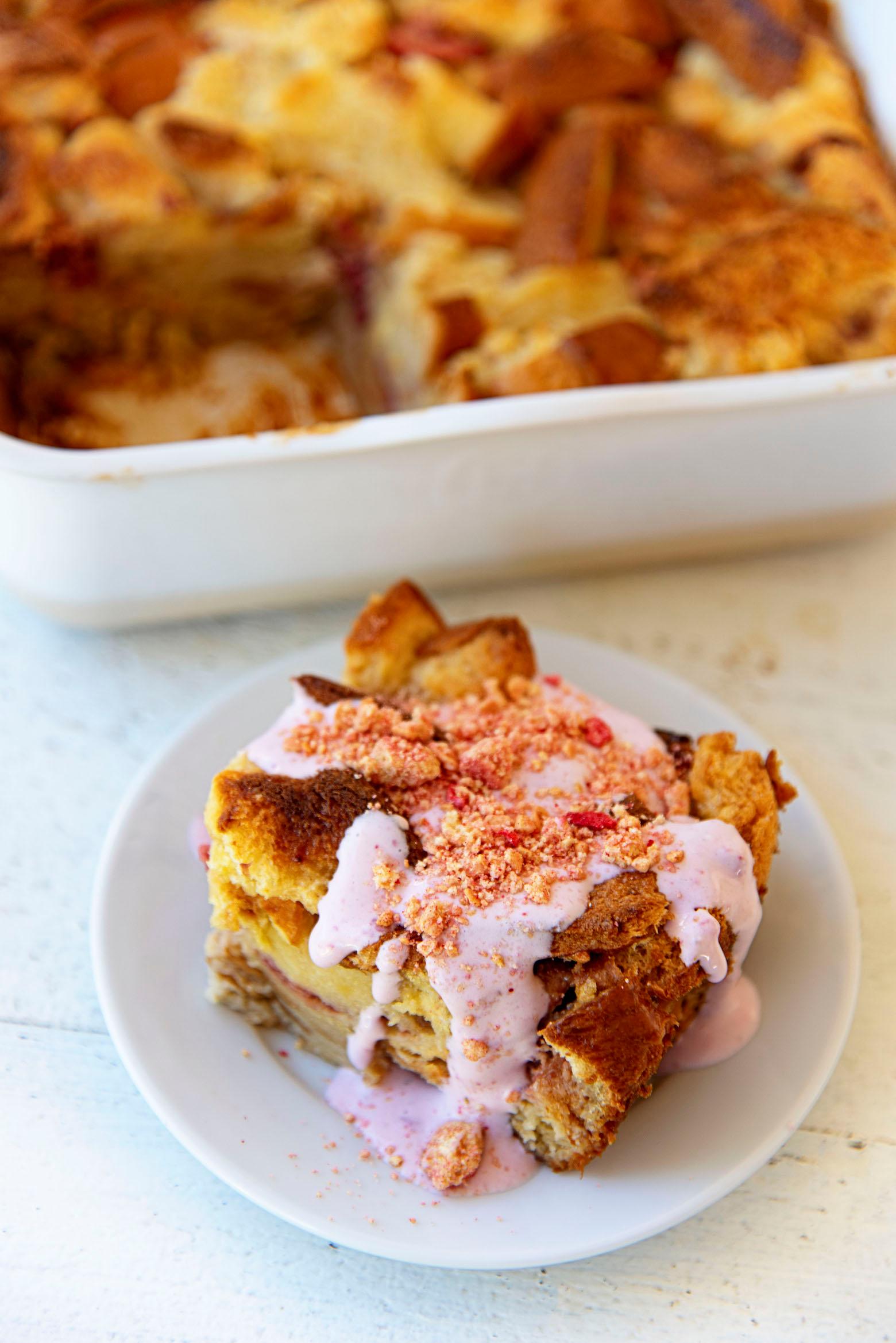 ingredients for strawberry shortcake bread pudding laid out on a wooden table