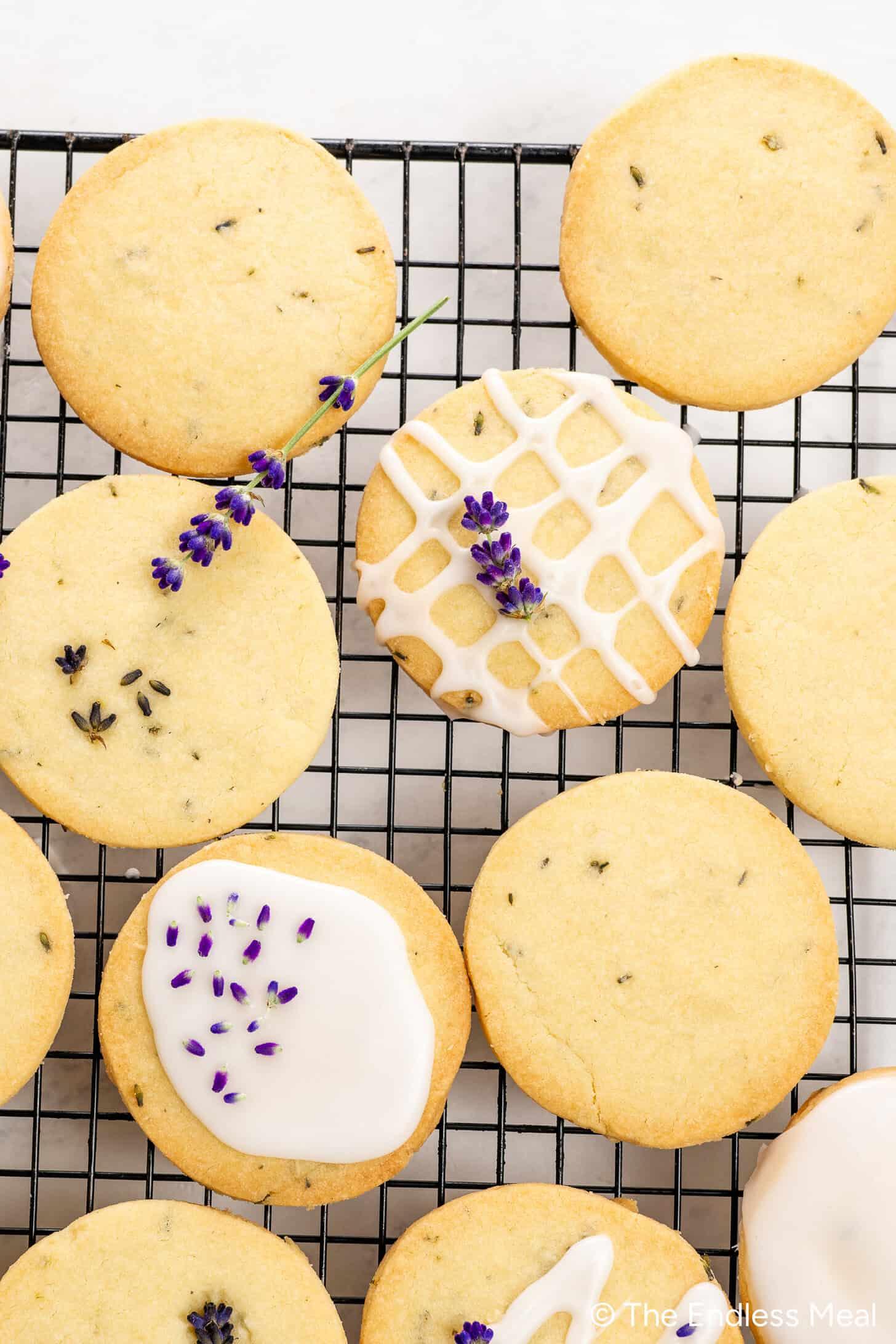 a batch of rhubarb lavender cookies cooling on a wire rack