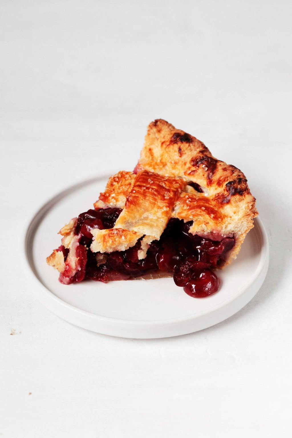 sliced clean eating cherry pie on a plate