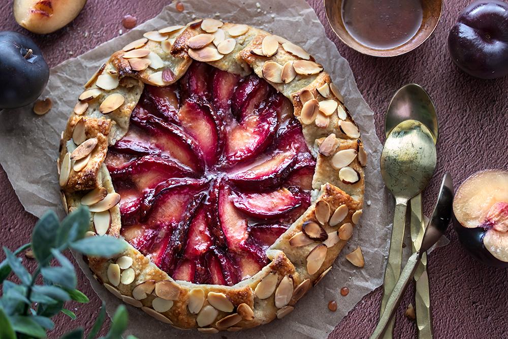 cherry plum and almond tart being sliced