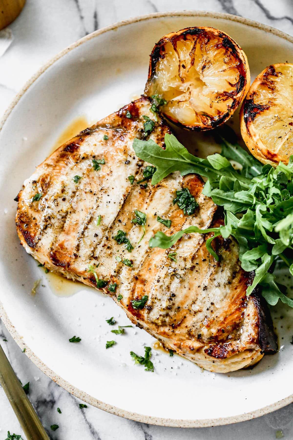 close-up of perfectly grilled swordfish with char marks