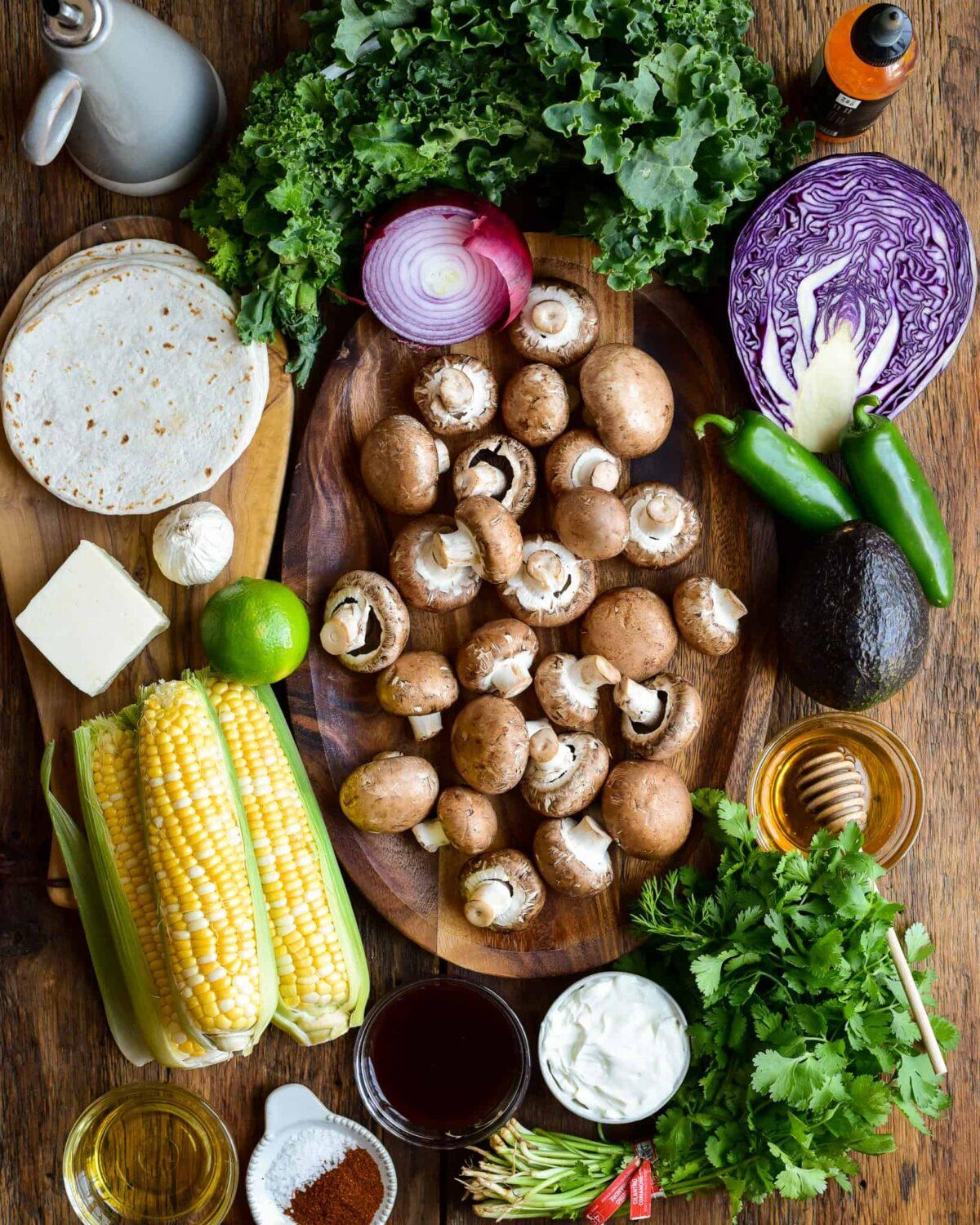 cremini mushrooms and grilled corn cobs on a kitchen counter