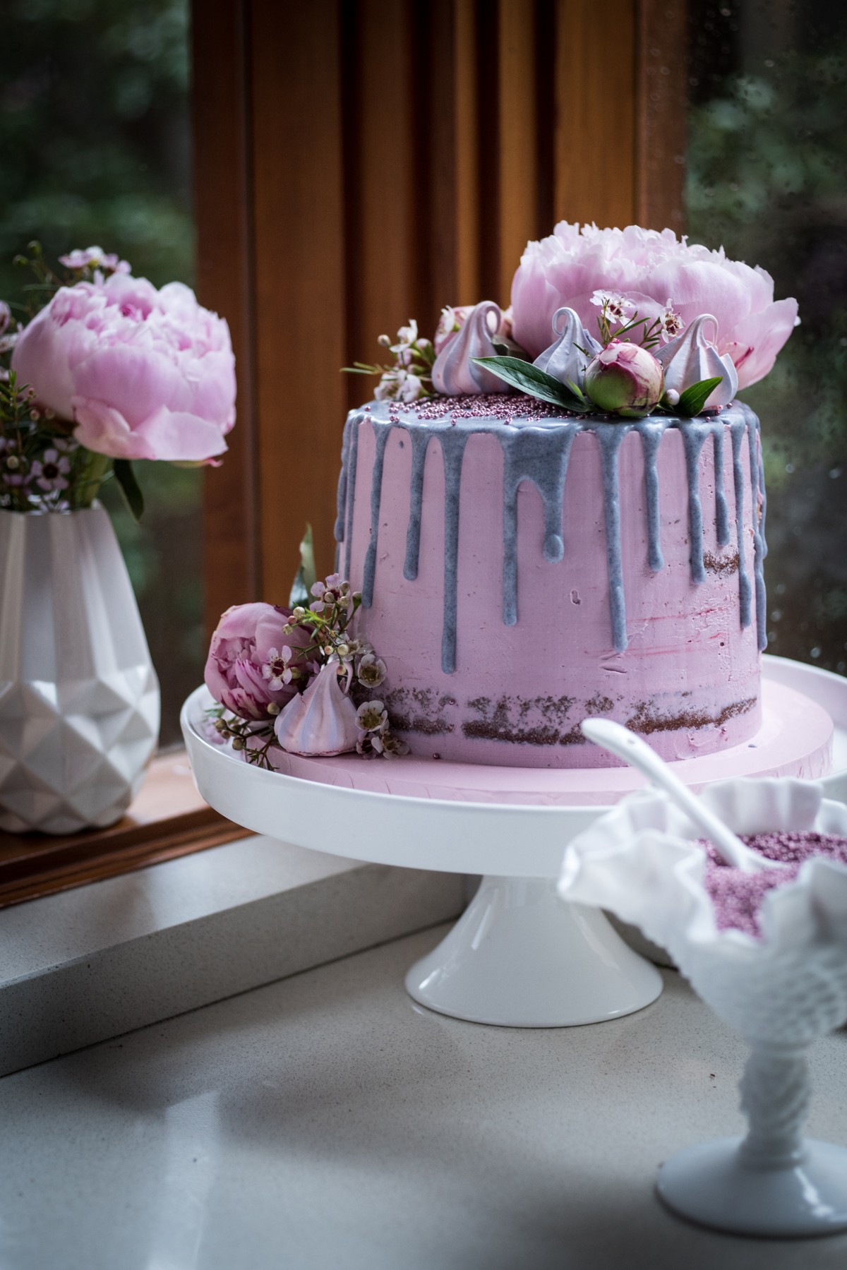 vanilla birthday cake decorated with pastel wafer paper flowers