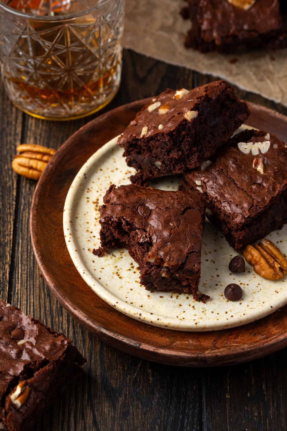 vegan bourbon pecan brownies on a wooden board