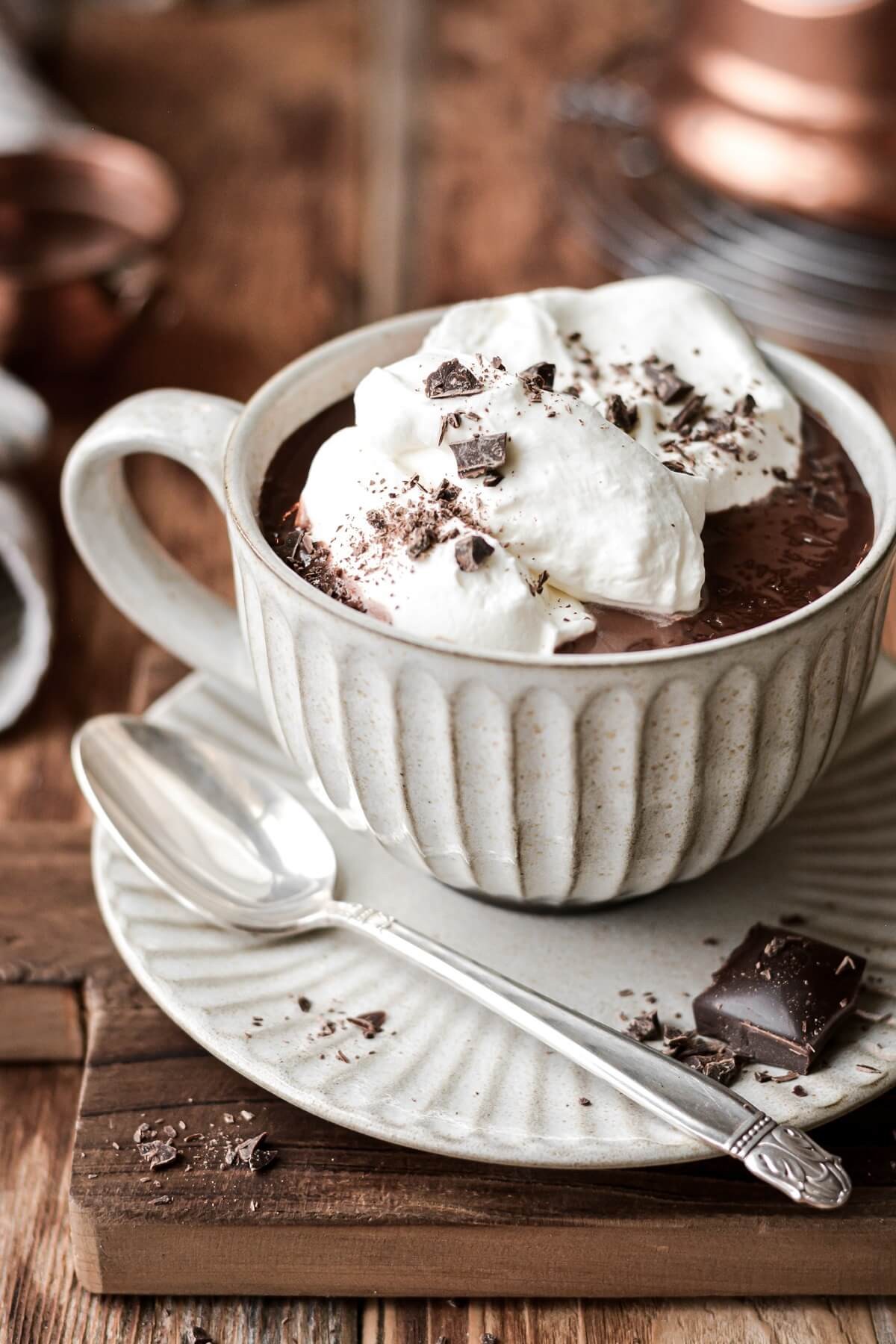 Rich creamy hot chocolate with homemade whipped cream and chocolate shavings
